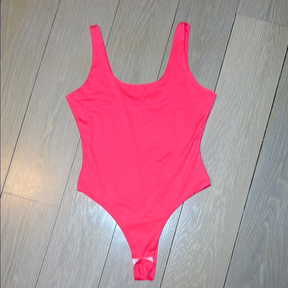 Neon pink body suit